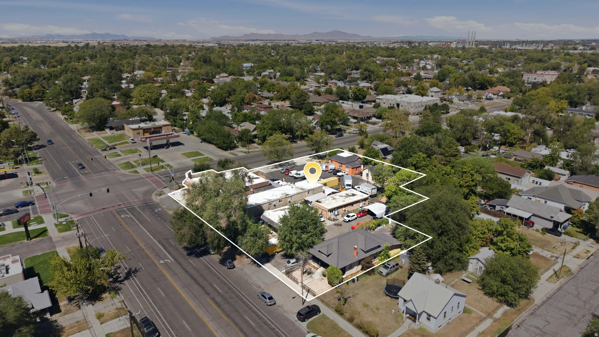 Aerial perspective showcasing a corner lot property