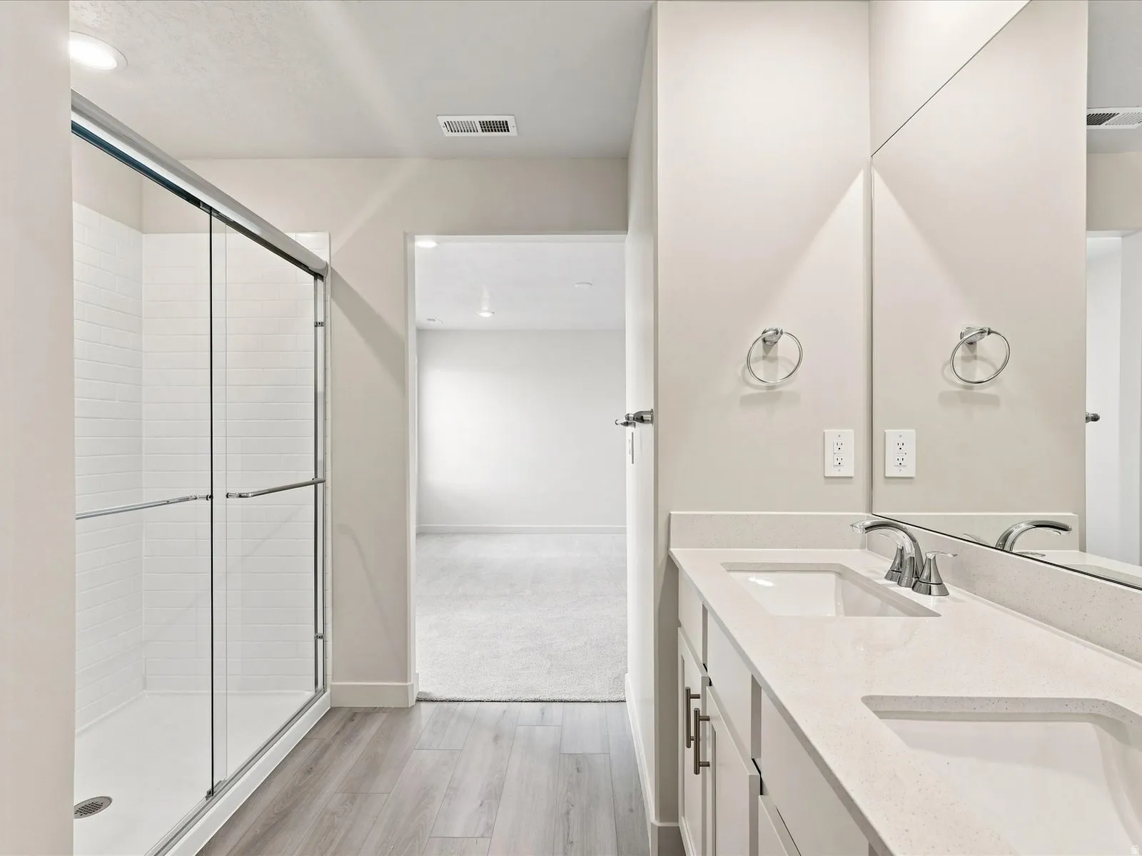 Double vanity with integrated sinks and chrome fixtures