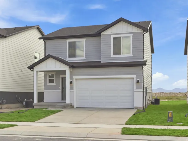 **DISCLAIMER** Elevation may vary on actual home. Contemporary exterior with light gray siding, white trim accents, and a dark shingle roof