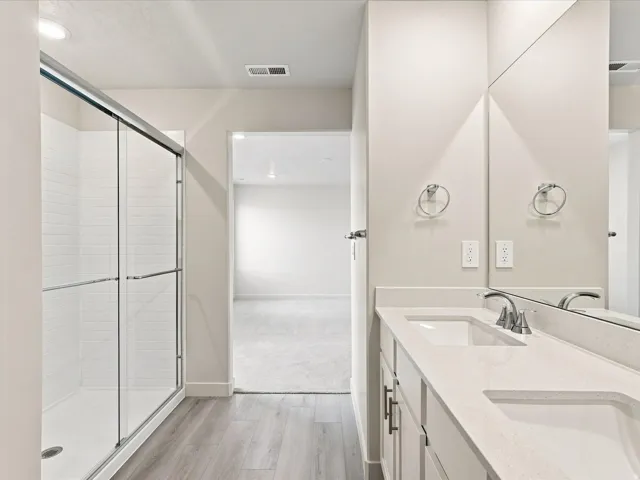 Double vanity with integrated sinks and chrome fixtures