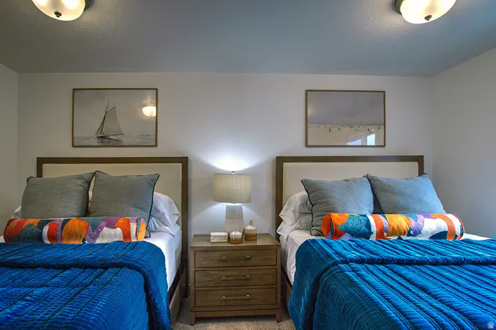 Dual beds with upholstered headboards