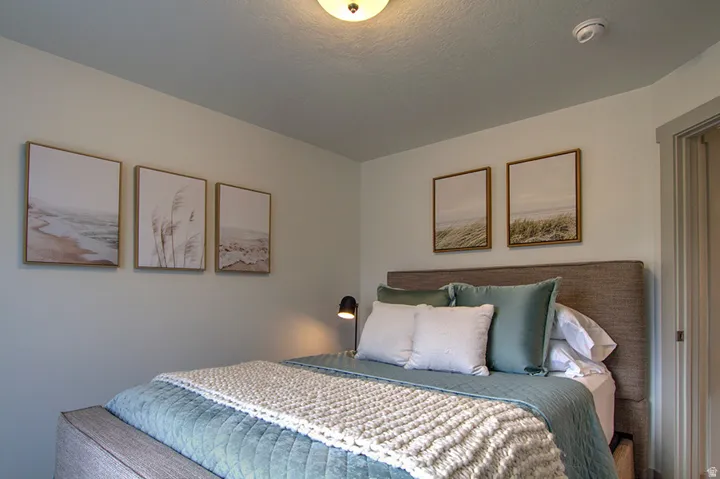 White painted walls and a light blue painted ceiling with a flush mount light fixture