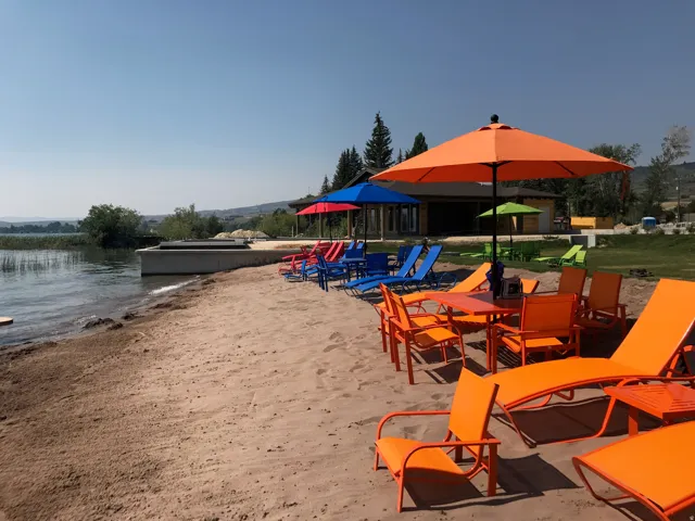 Sandy beach shoreline with a concrete retaining wall