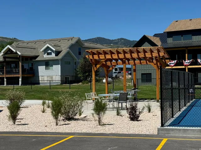 Outdoor pergola-covered patio with seating