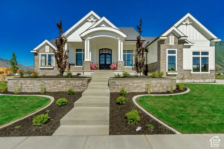 Stone and siding exterior with prominent gables