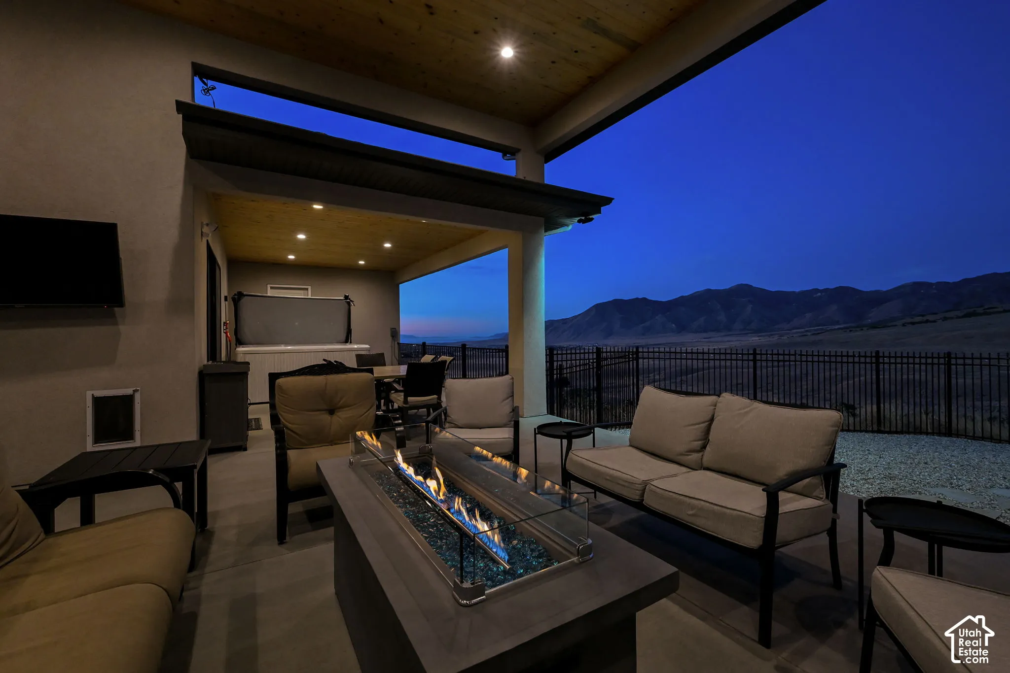 Covered patio featuring recessed lighting, wood-finish ceiling, and mountain scenery