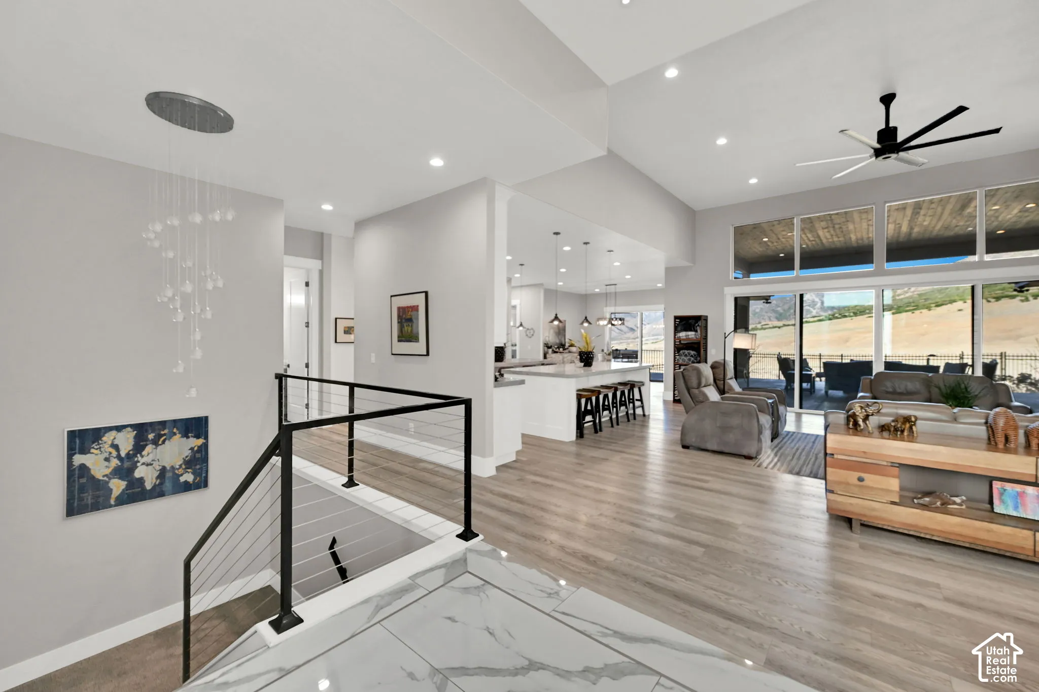 Vaulted ceilings, recessed lighting, and expansive glass doors
