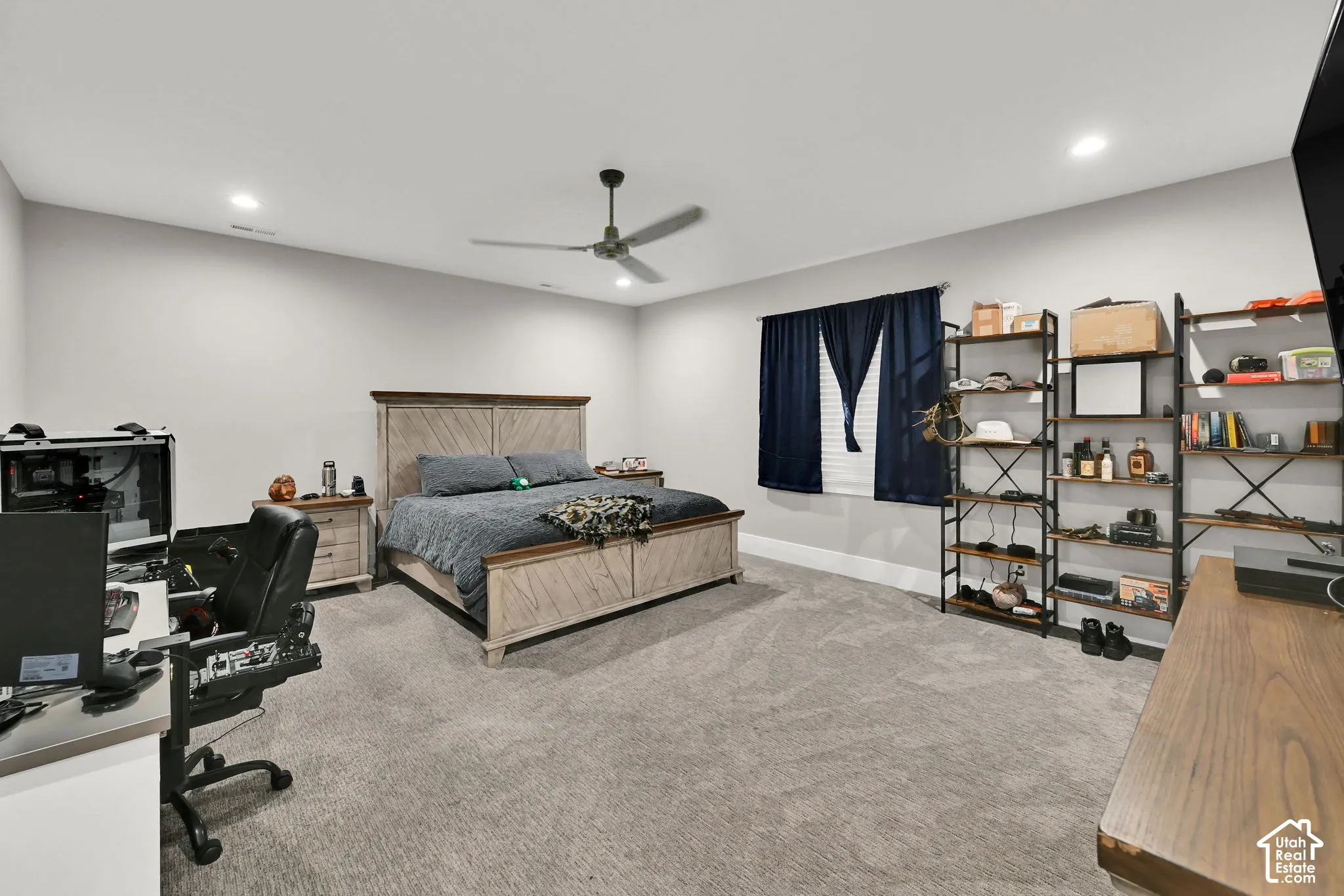 Carpeted flooring, recessed lighting, ceiling fan, window with blinds