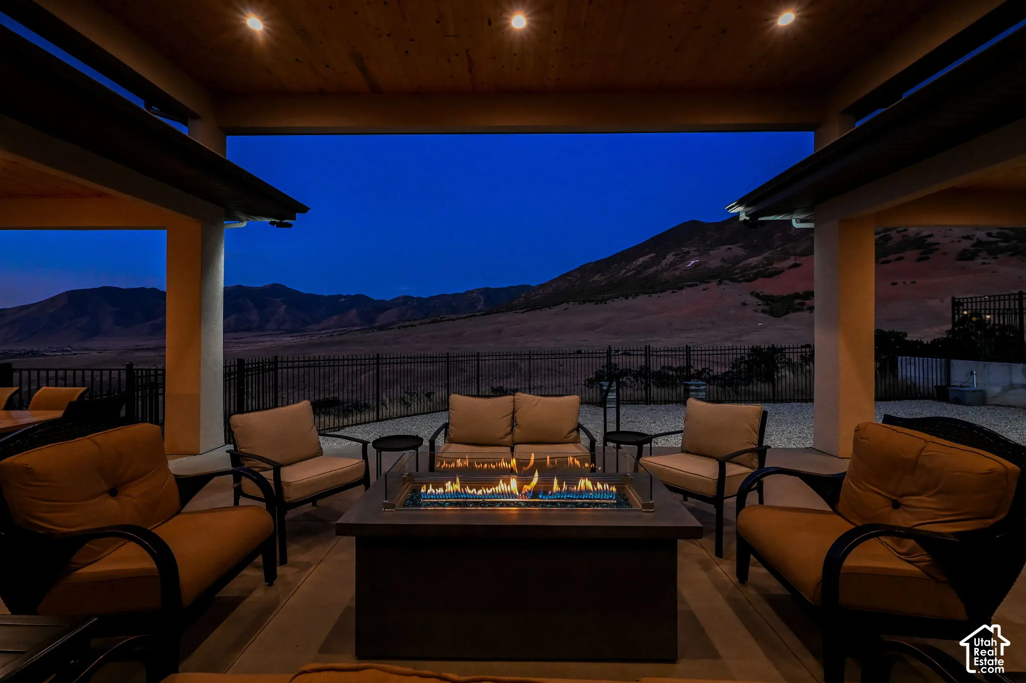 Covered patio with recessed lighting, and mountain backdrop