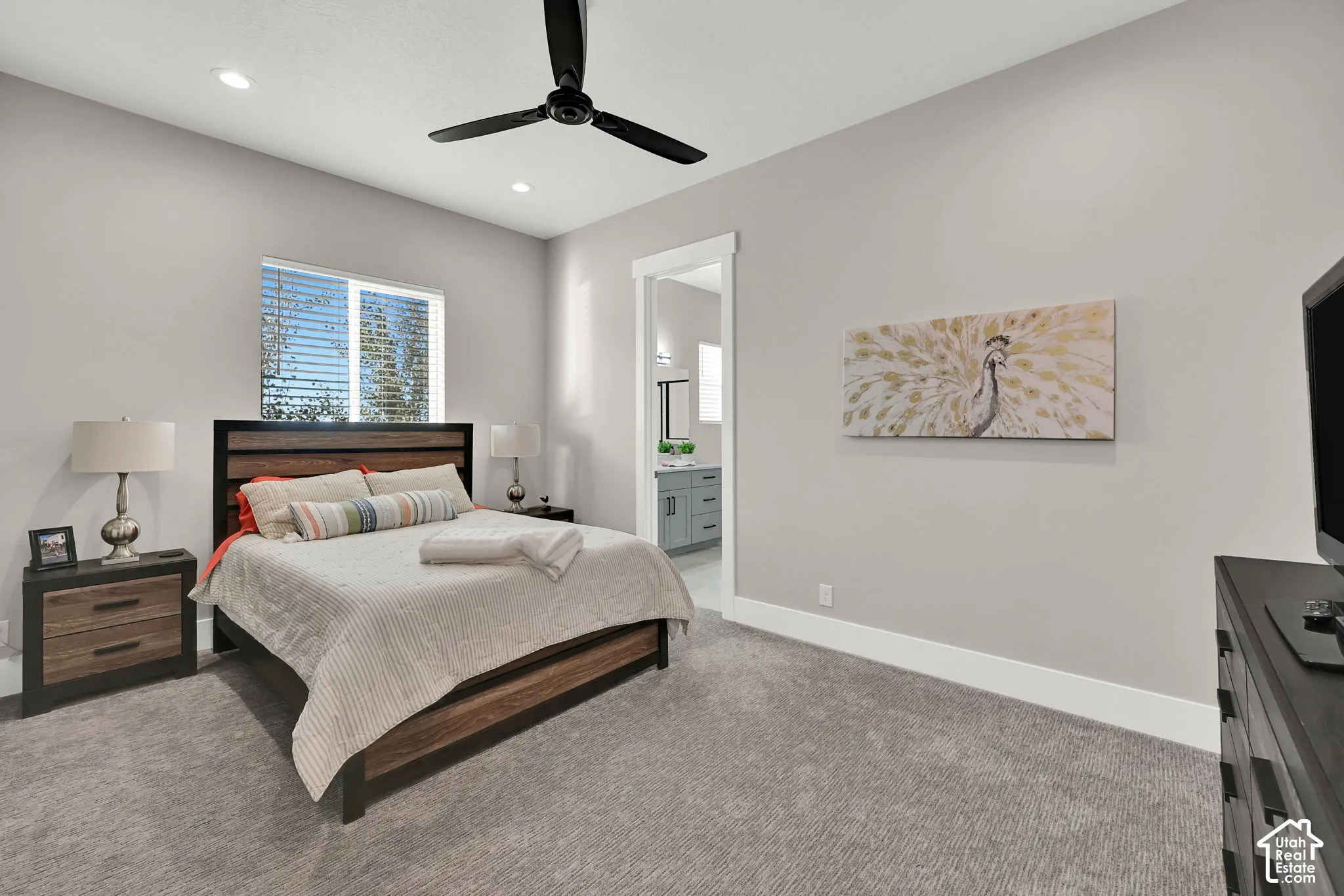Recessed lighting, ceiling fan, and carpeted flooring