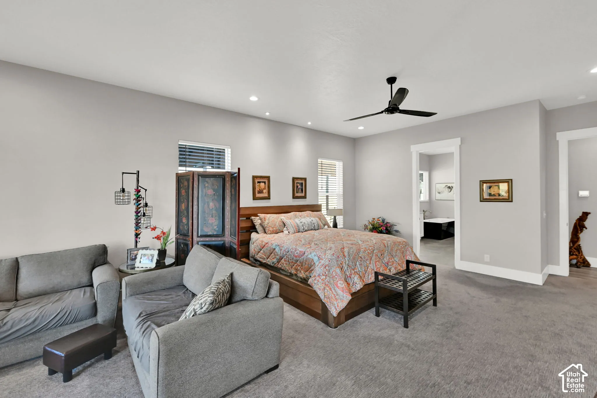 Recessed lighting, ceiling fan, and carpeted flooring