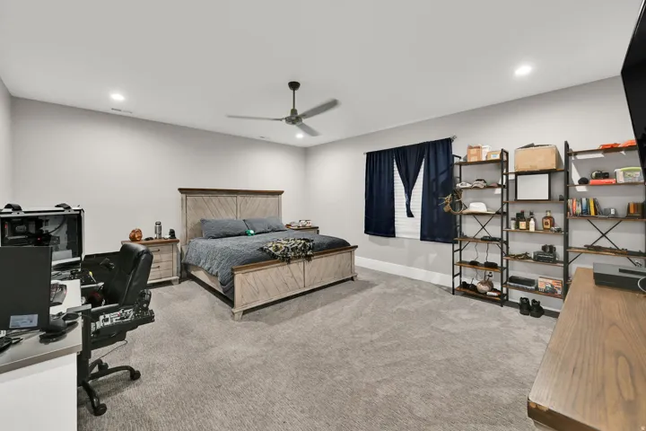 Carpeted flooring, recessed lighting, ceiling fan, window with blinds