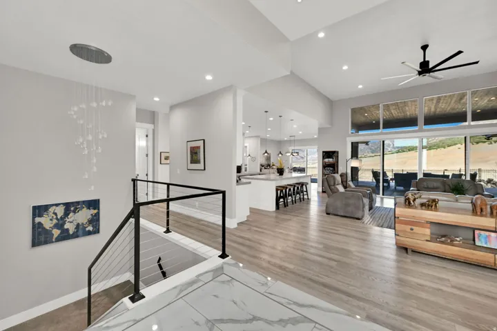 Vaulted ceilings, recessed lighting, and expansive glass doors