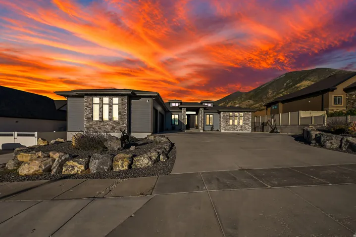 Contemporary exterior featuring stone accents and horizontal siding