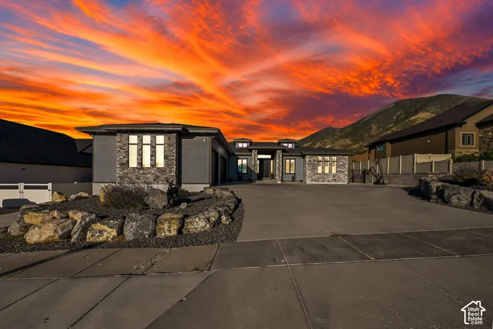 Contemporary exterior featuring stone accents and horizontal siding