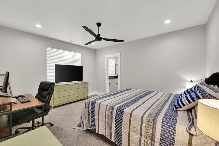 Recessed lighting, modern ceiling fan, window with blinds, and durable carpeting
