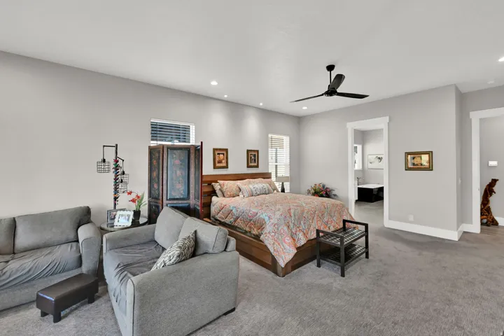 Recessed lighting, ceiling fan, and carpeted flooring