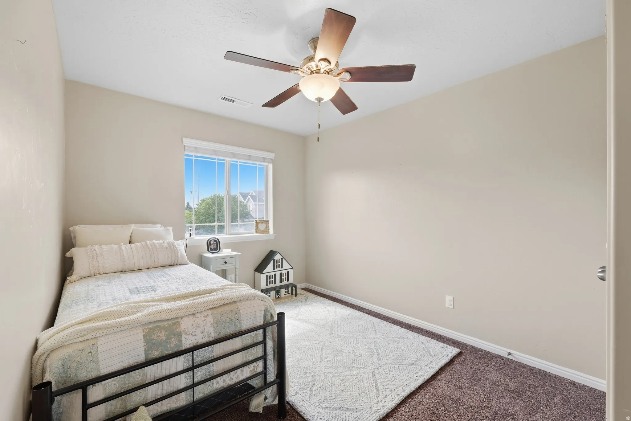 Recessed lighting, ceiling fan with integrated light fixture, neutral wall paint, white window trim, and carpeted flooring
