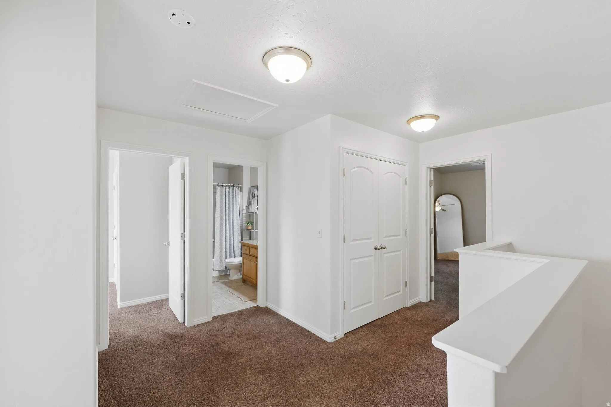 White walls and brown carpeting throughout