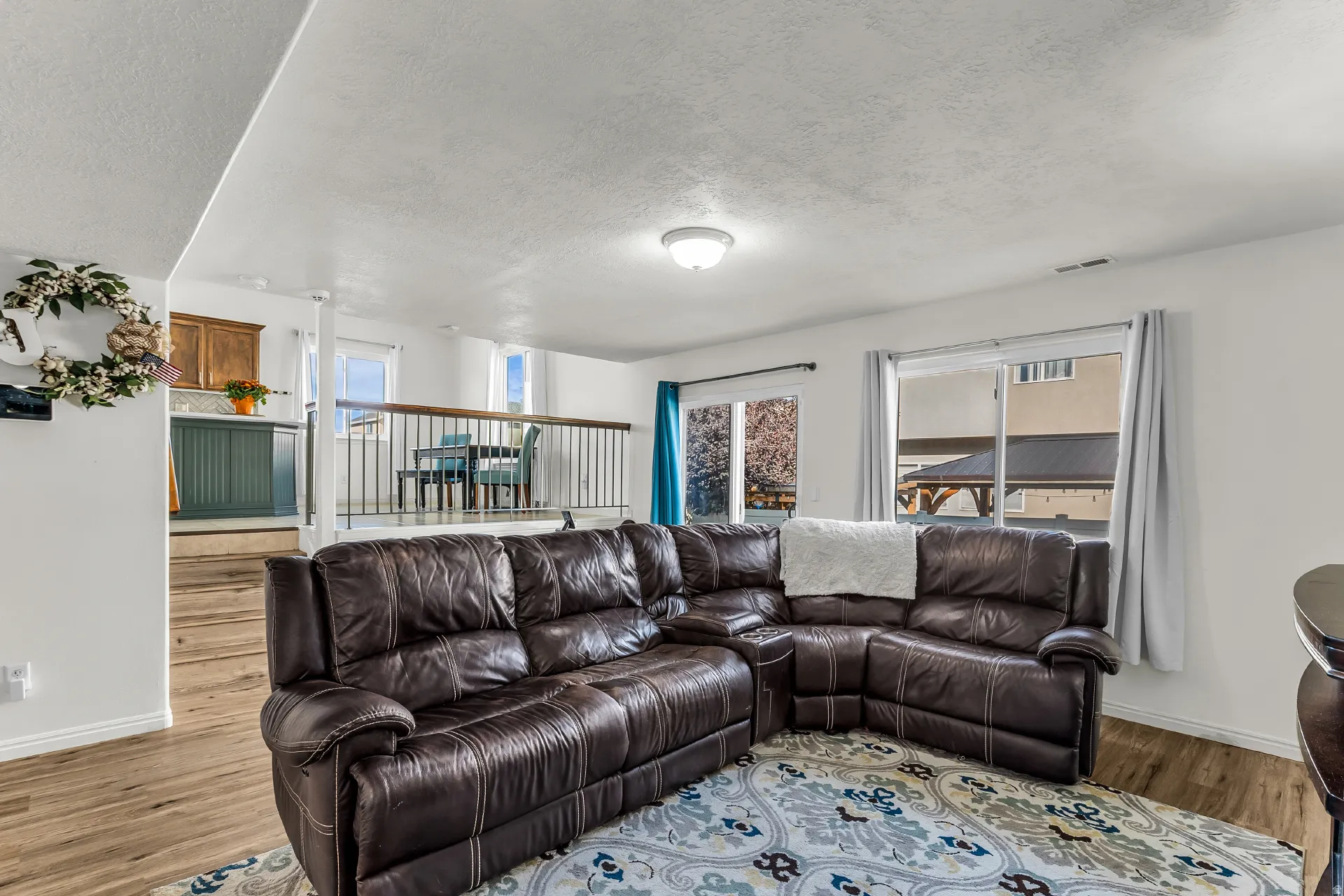 Open family room with same LVP throughout the main level and backyard access.