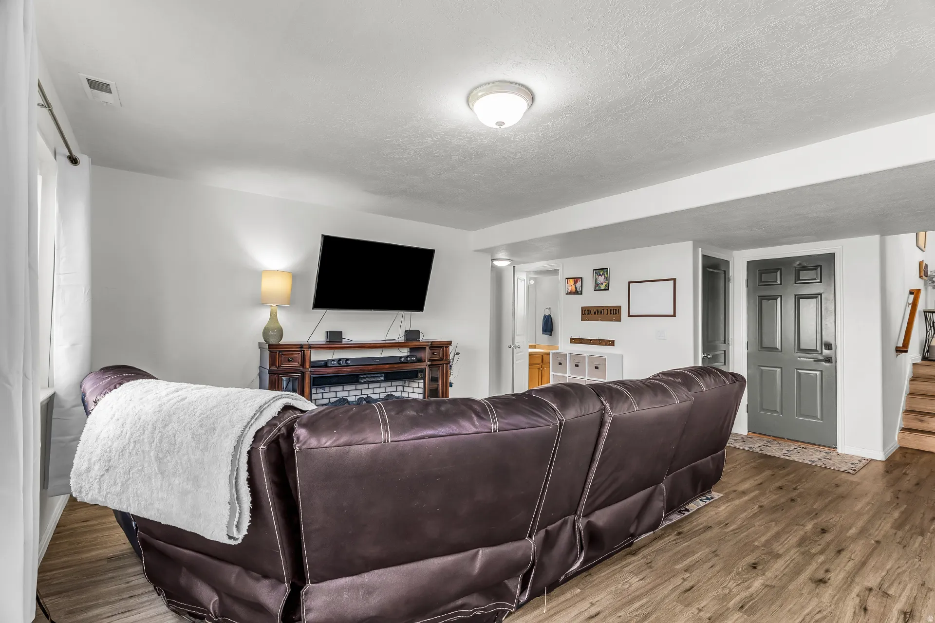 Open family room with same LVP throughout the main level. Convenient half bath and garage access.