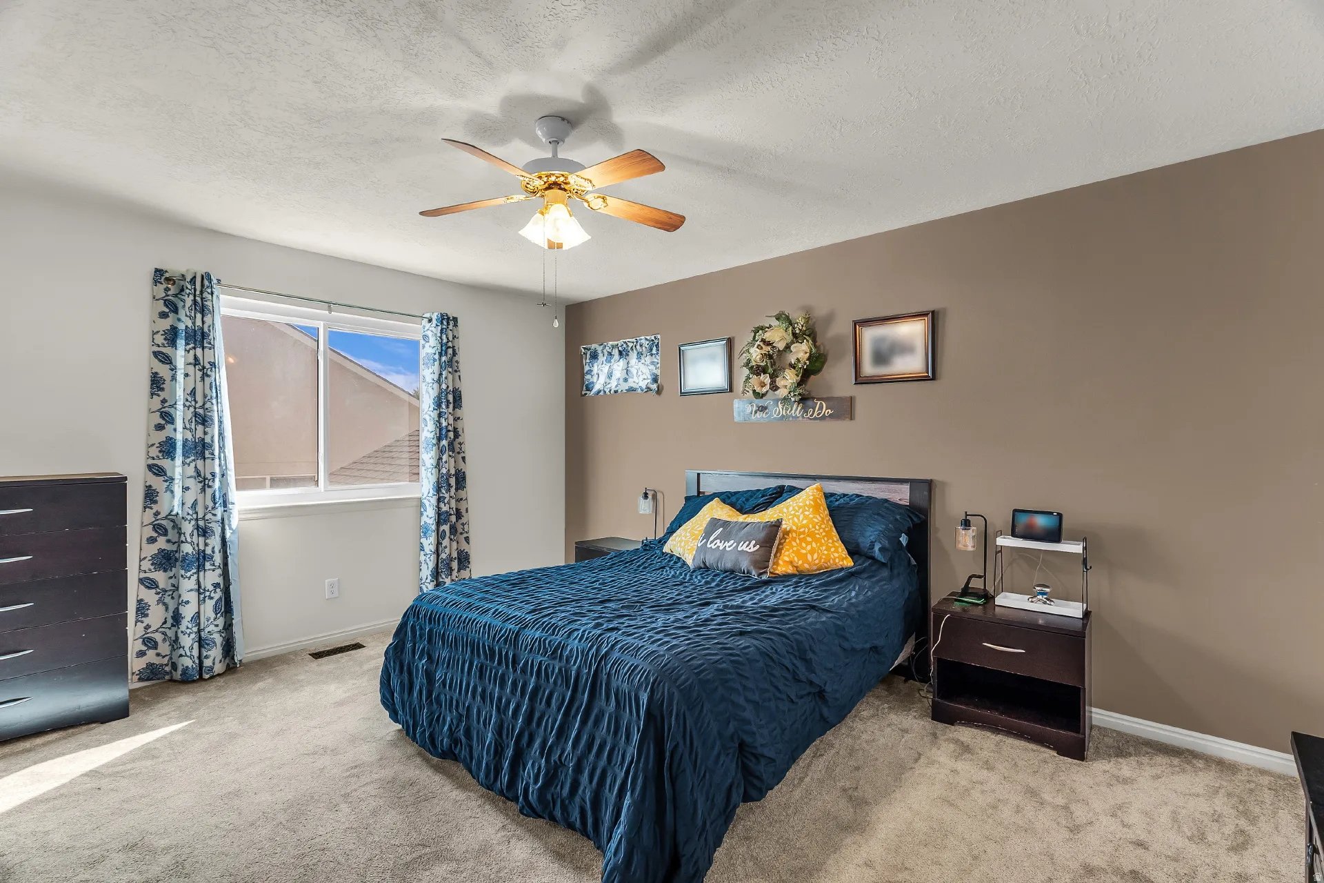 Large owners suite with new carpet, walk in closet and ceiling fan.