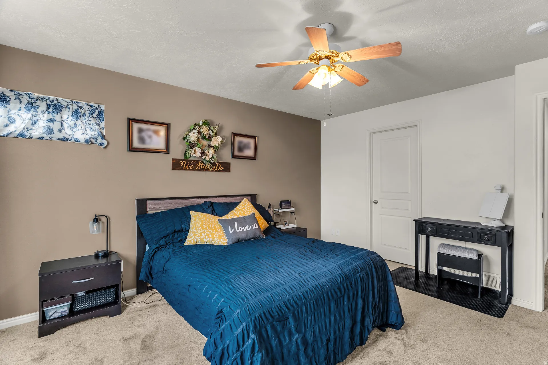 Large owners suite with new carpet, walk in closet and ceiling fan.