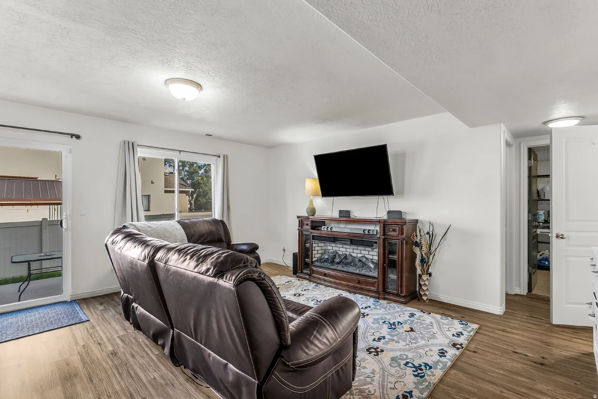 Open family room with same LVP throughout the main level and backyard access.