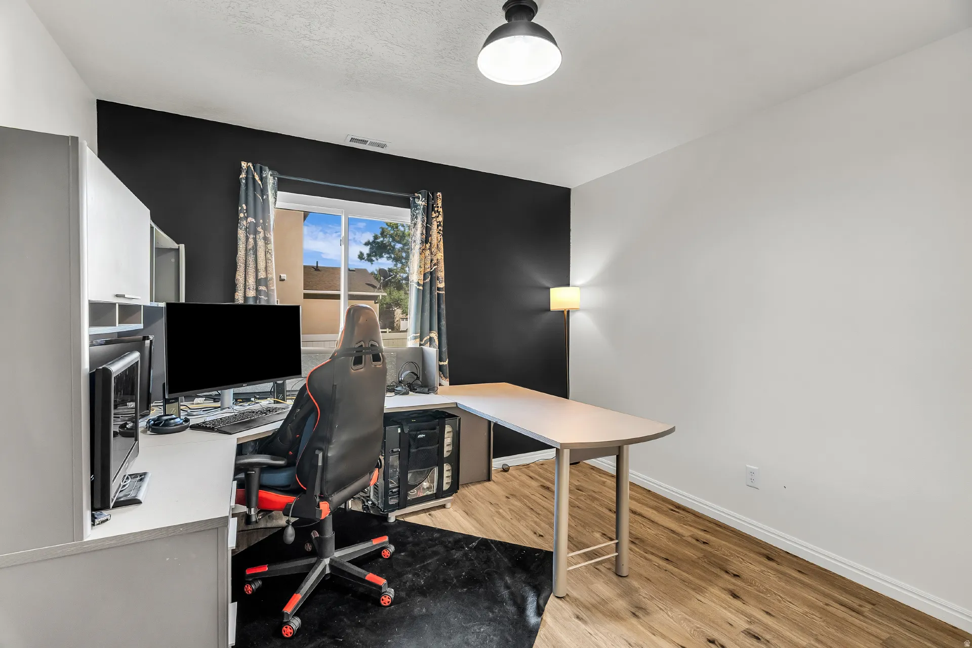 Main level bedroom that can also be useful as an office space.