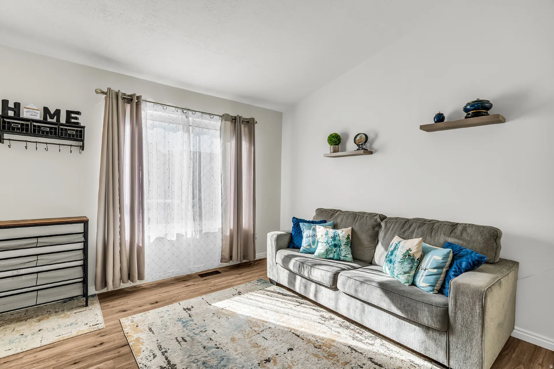 Open living room with lots of natural light, updated paint and LVP flooring. Vaulted ceilings and recessed lighting.