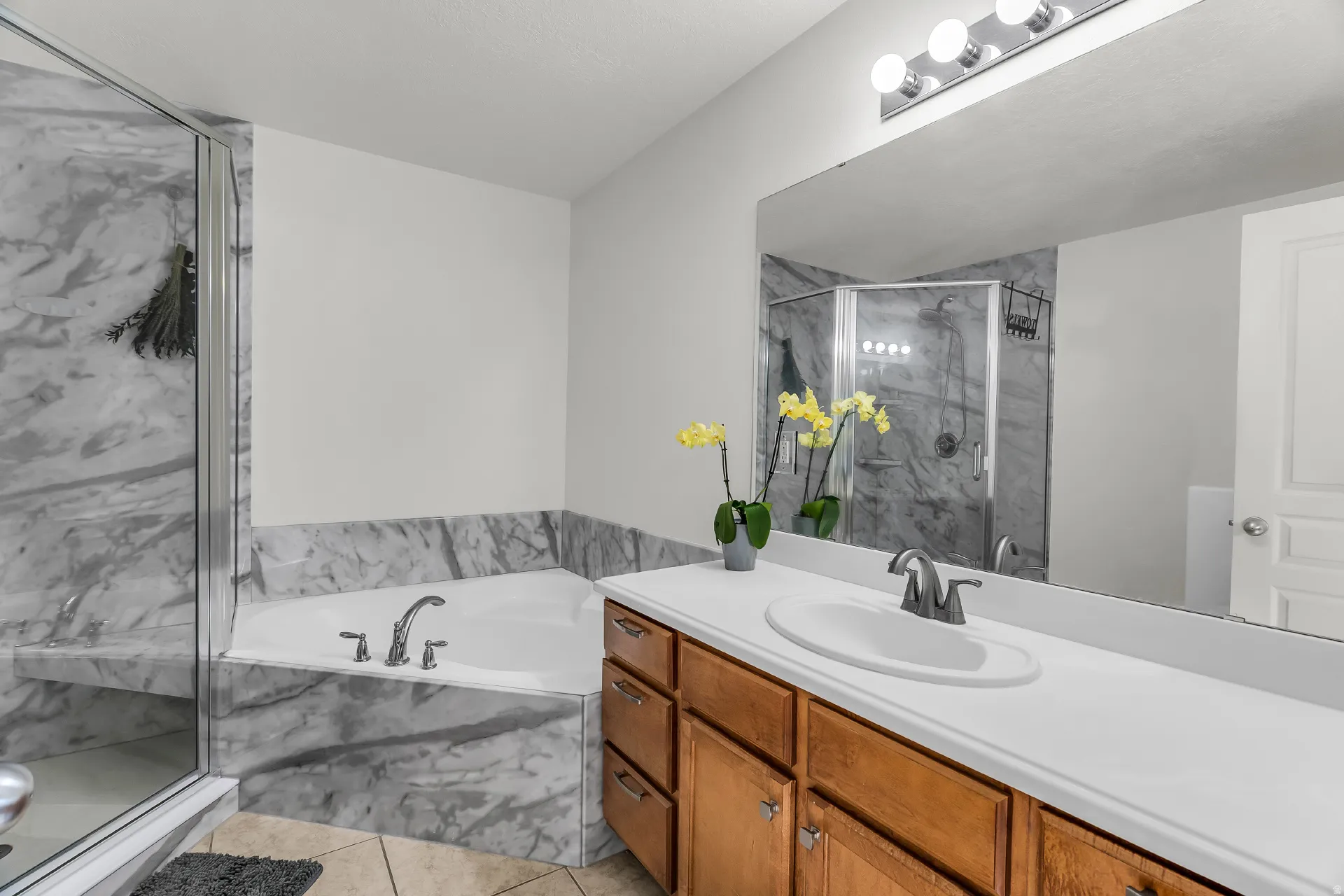Owners suite bathroom with garden tub and remodeled spa like shower.