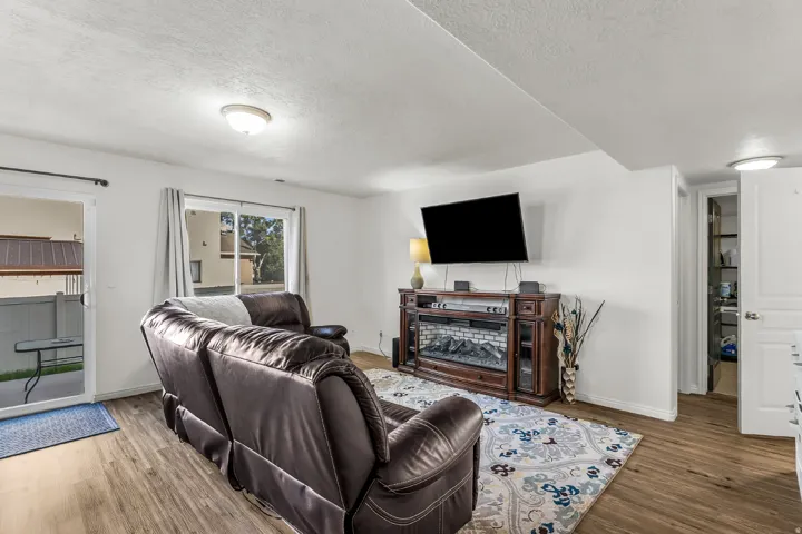 Open family room with same LVP throughout the main level and backyard access.