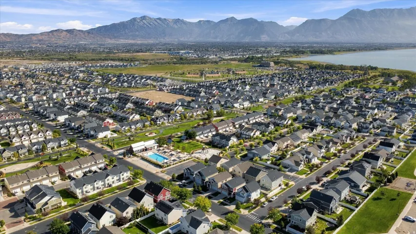 Residential community featuring a lake and mountain backdrop