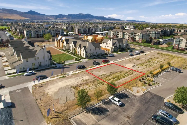 Vacant lot featuring mountain scenery and established neighborhood infrastructure