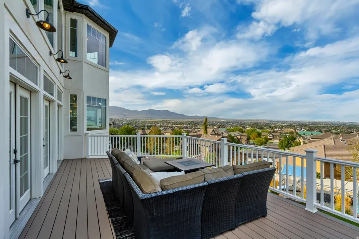 Expansive deck featuring composite decking and white railings