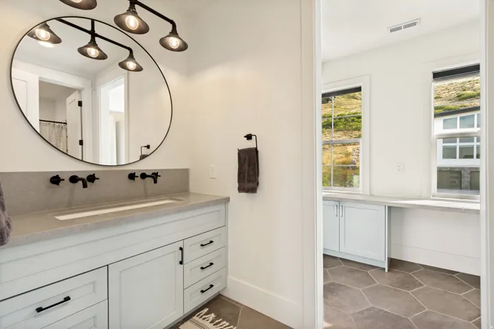 Dual vanity with integrated rectangular sink and matte black wall-mounted faucets
