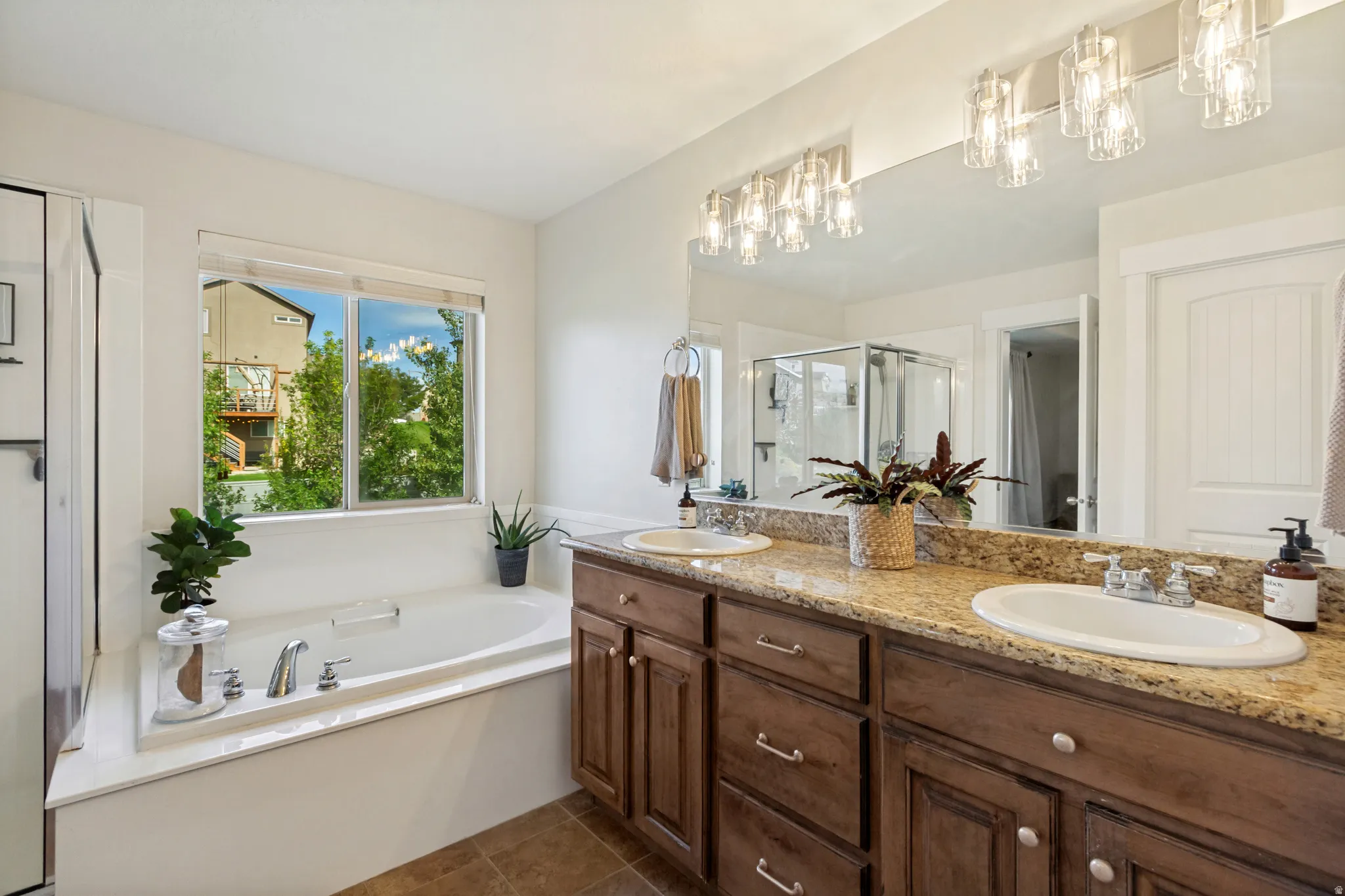Dual vanity with integrated sinks and a stone-finish countertop