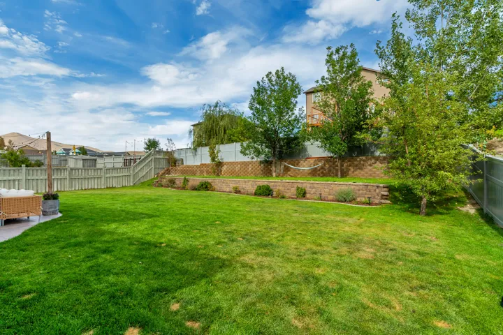 Expansive lawn area with a concrete patio