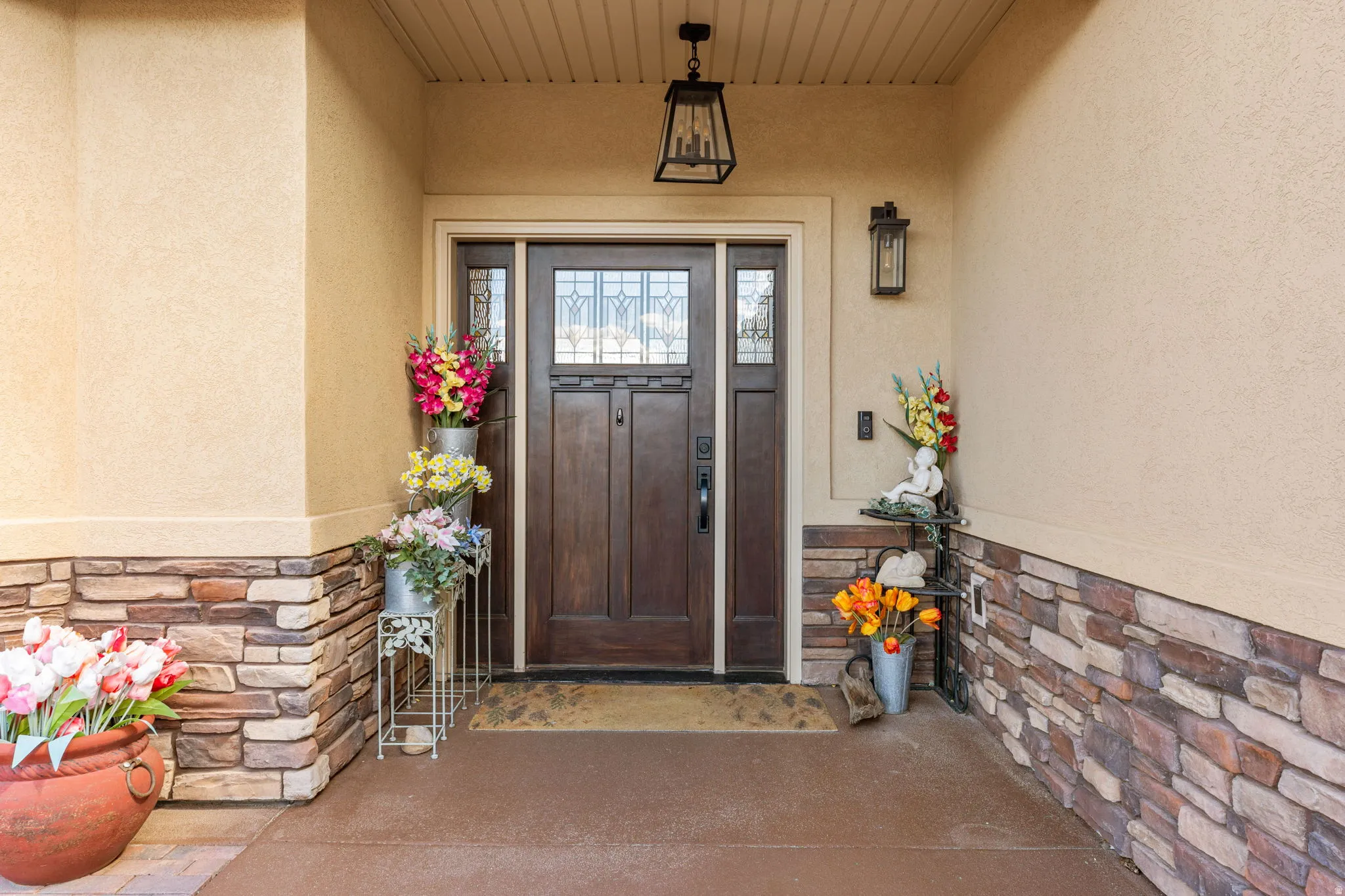 Textured stucco exterior with stone veneer detailing