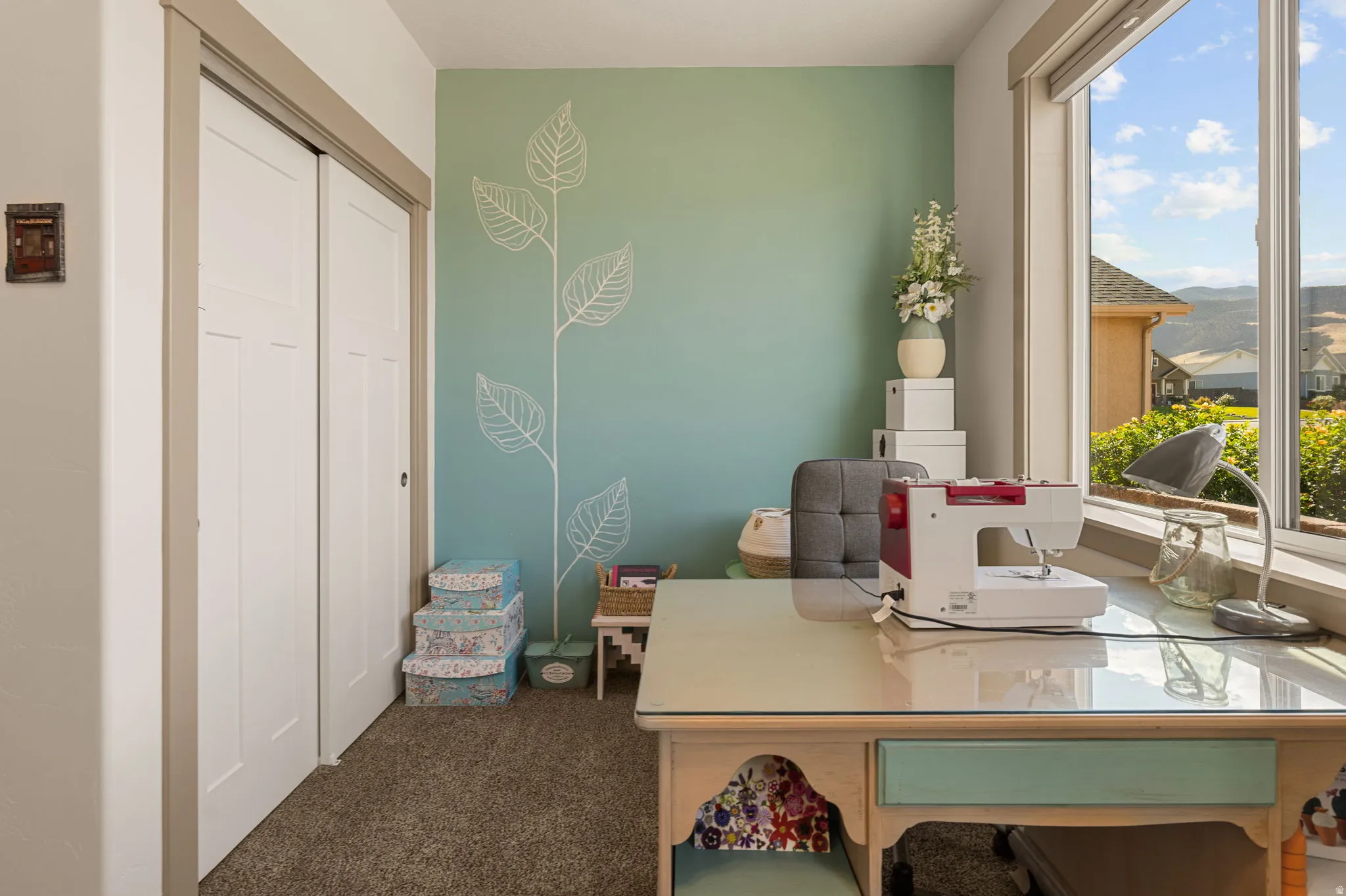 Integrated window offering natural light, carpeted flooring, and a built-in closet with panel doors