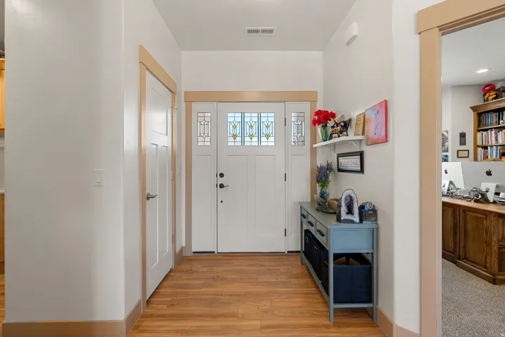 Wood-finish flooring throughout the entry