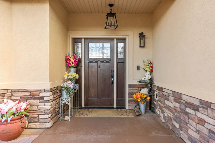 Textured stucco exterior with stone veneer detailing
