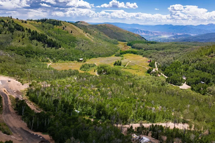 Expansive mountain terrain with varied topography and dense tree coverage