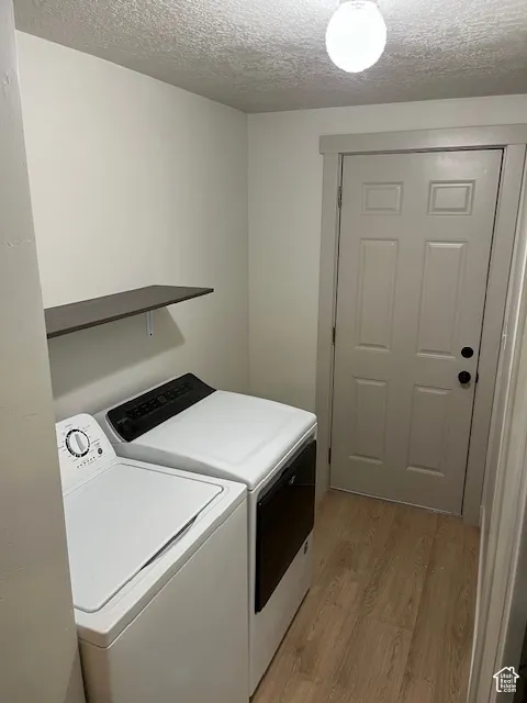Built-in shelving, wood-finish flooring, and a flush-mount ceiling light