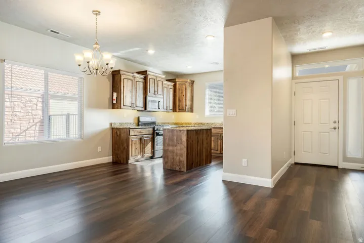 Expansive wood-finish flooring throughout