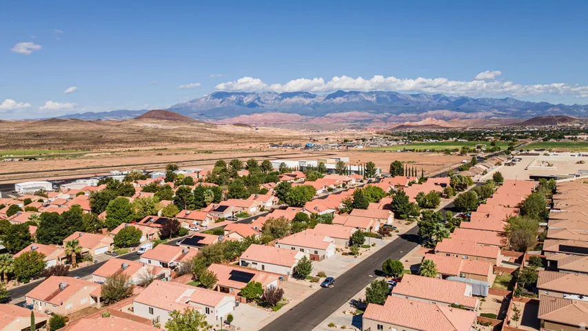 Residential neighborhood featuring uniform tile roofs and established landscaping
