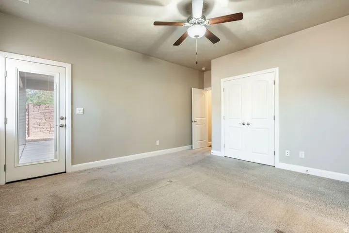 Recessed lighting, ceiling fan with light fixture, carpeted flooring, French door with glass panel, white paneled double doors