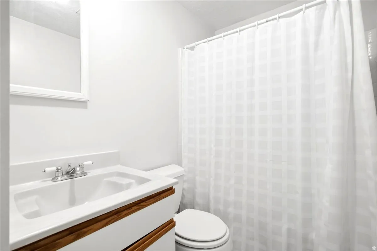 White vanity with an integrated sink and chrome faucet