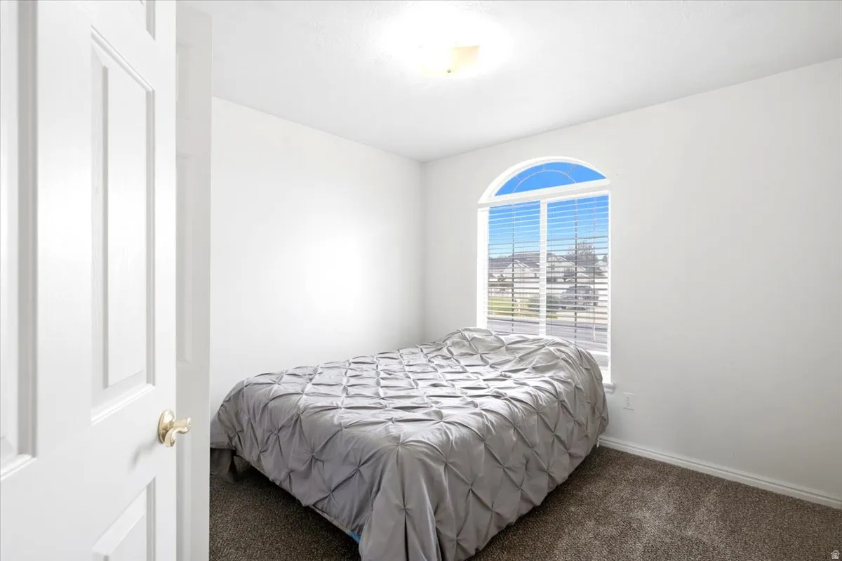 Arched window with horizontal blinds