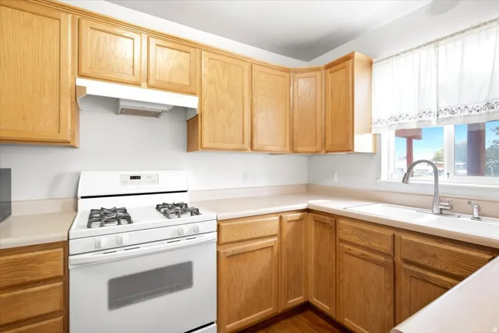 Wood-finish cabinetry paired with light-toned countertops